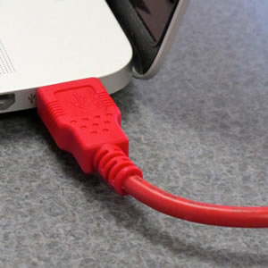 USB cable connected to a laptop