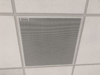 Photo of ceiling mic installed flush with other tiles