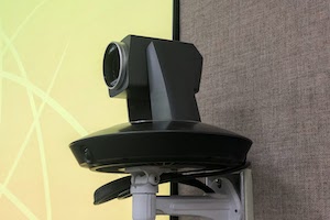 Auto tracking camera mounted on wall.